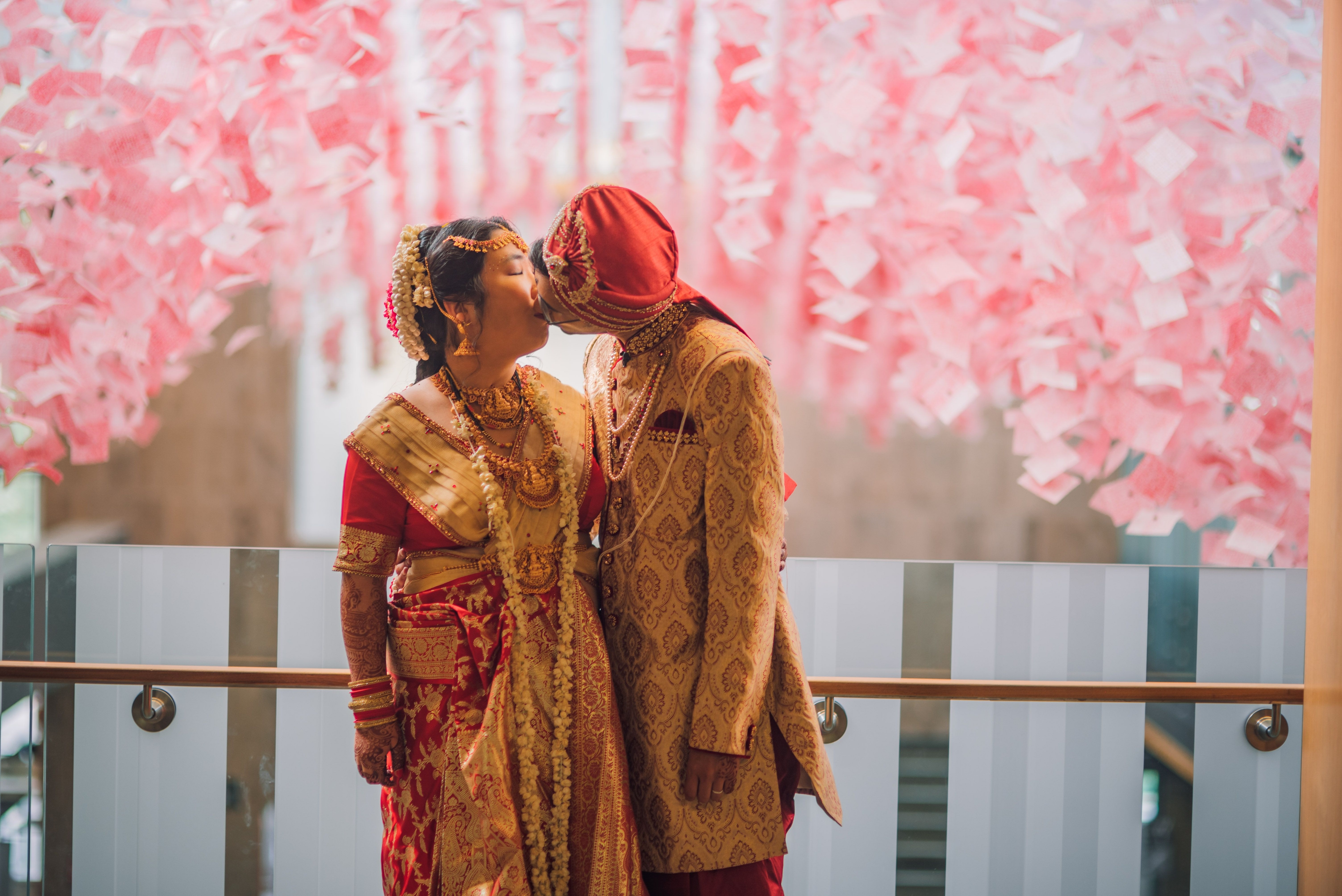 The Wedding Ring, Kitchener Public Library, Peter B Photography, KW wedding photographer, Kitchener wedding venue, Waterloo wedding venue, Cambridge wedding venue, bride and groom kissing in front of pink floral wall