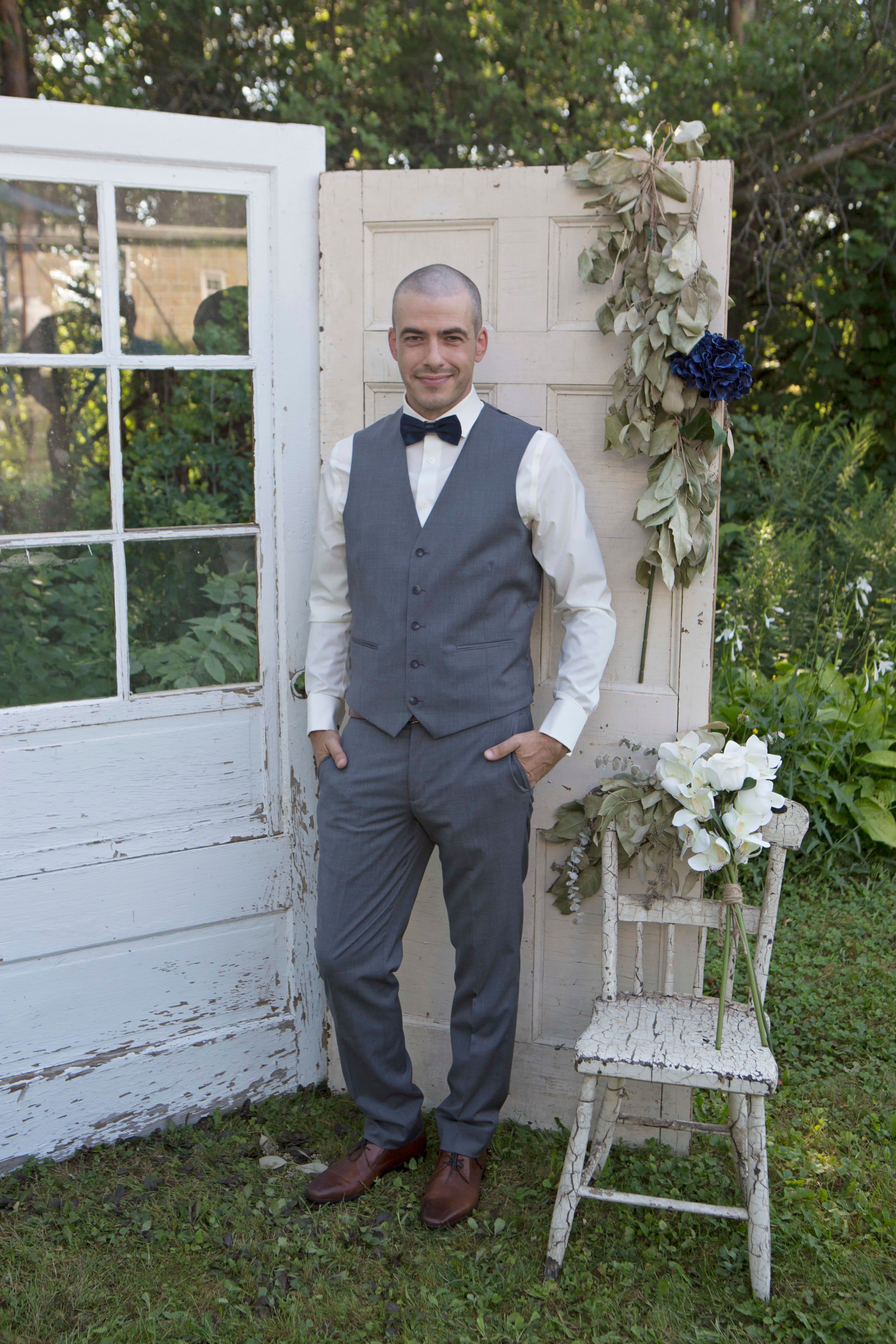 The wedding ring, Heart to heart photography, Thorold wedding photographer, wedding photographer, groom stand-in in front of a set of white doors