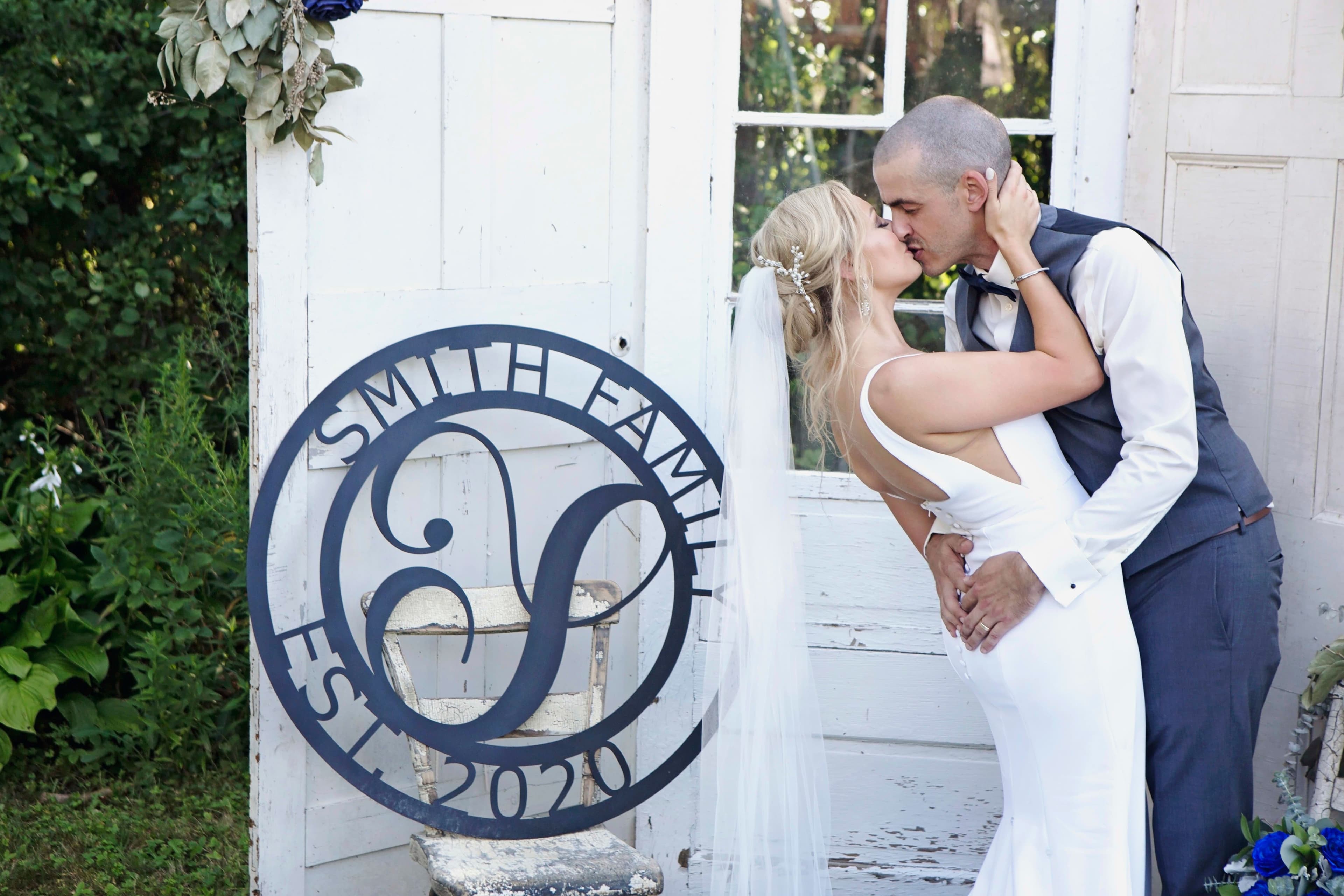 The wedding ring, Heart to heart photography, Thorold wedding photographer, wedding photographer, bride and groom kissing at the alter in front of a set of white doors