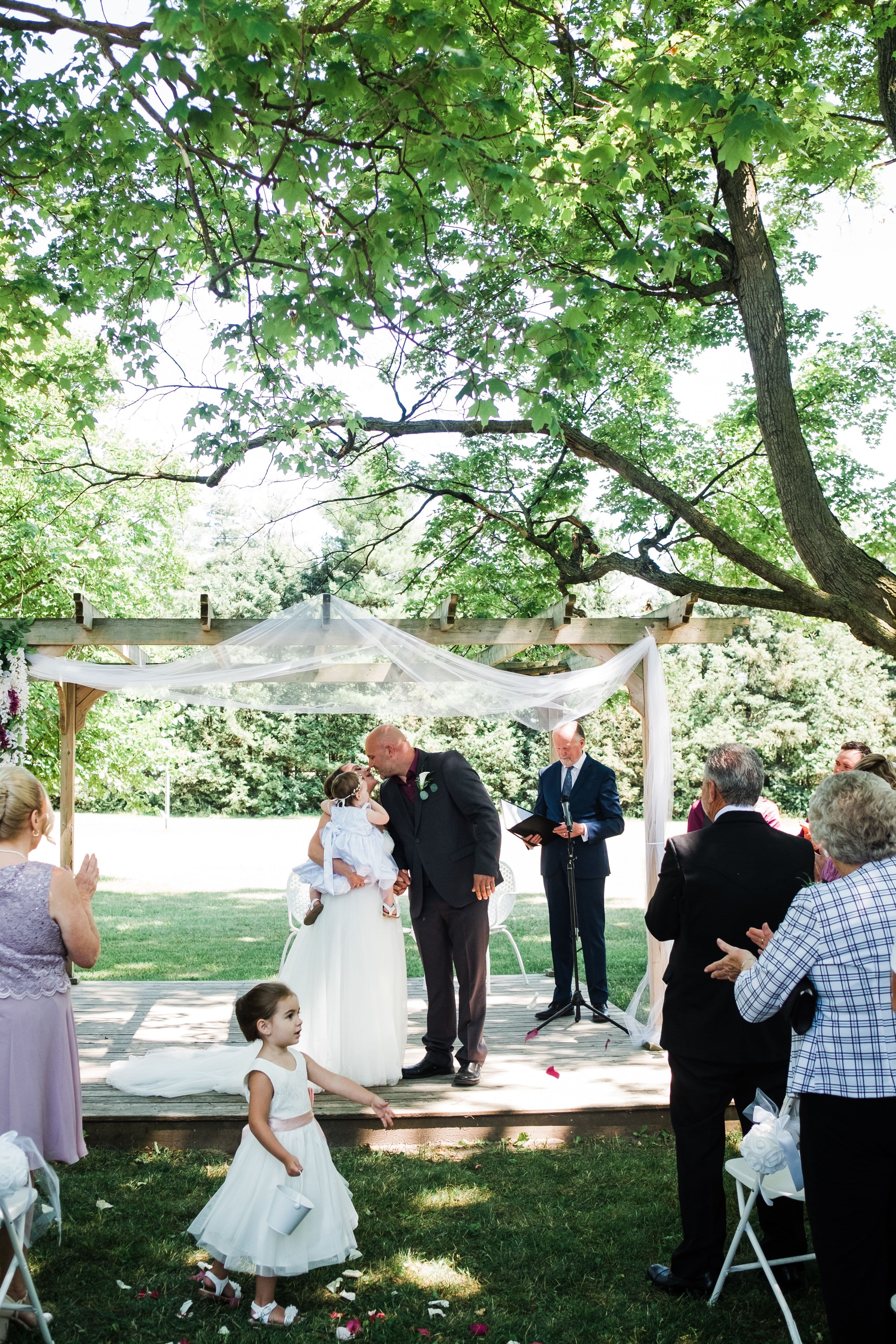 The wedding ring, Waterloo Regional Police Association, BMKH Photography, KW wedding photographer, Waterloo wedding venue, Kitchener wedding venue, Cambridge wedding venue, bride and groom having their first kiss after being pronounced married