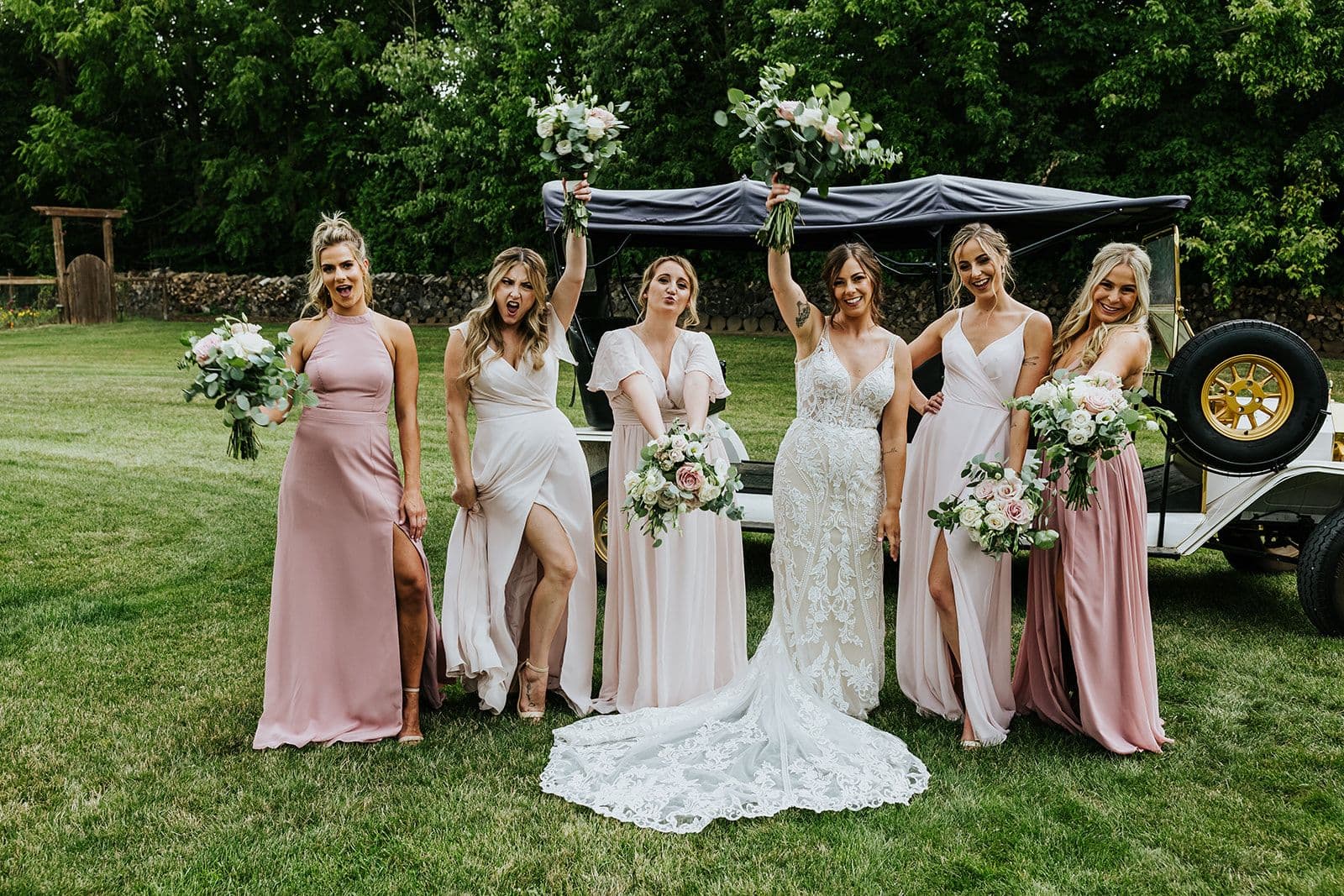 Erin Estates, Wedding Venue, Fedora Media, Cambridge Wedding Photographer, Bride and her Bridesmaids holding their bouquets and cheering