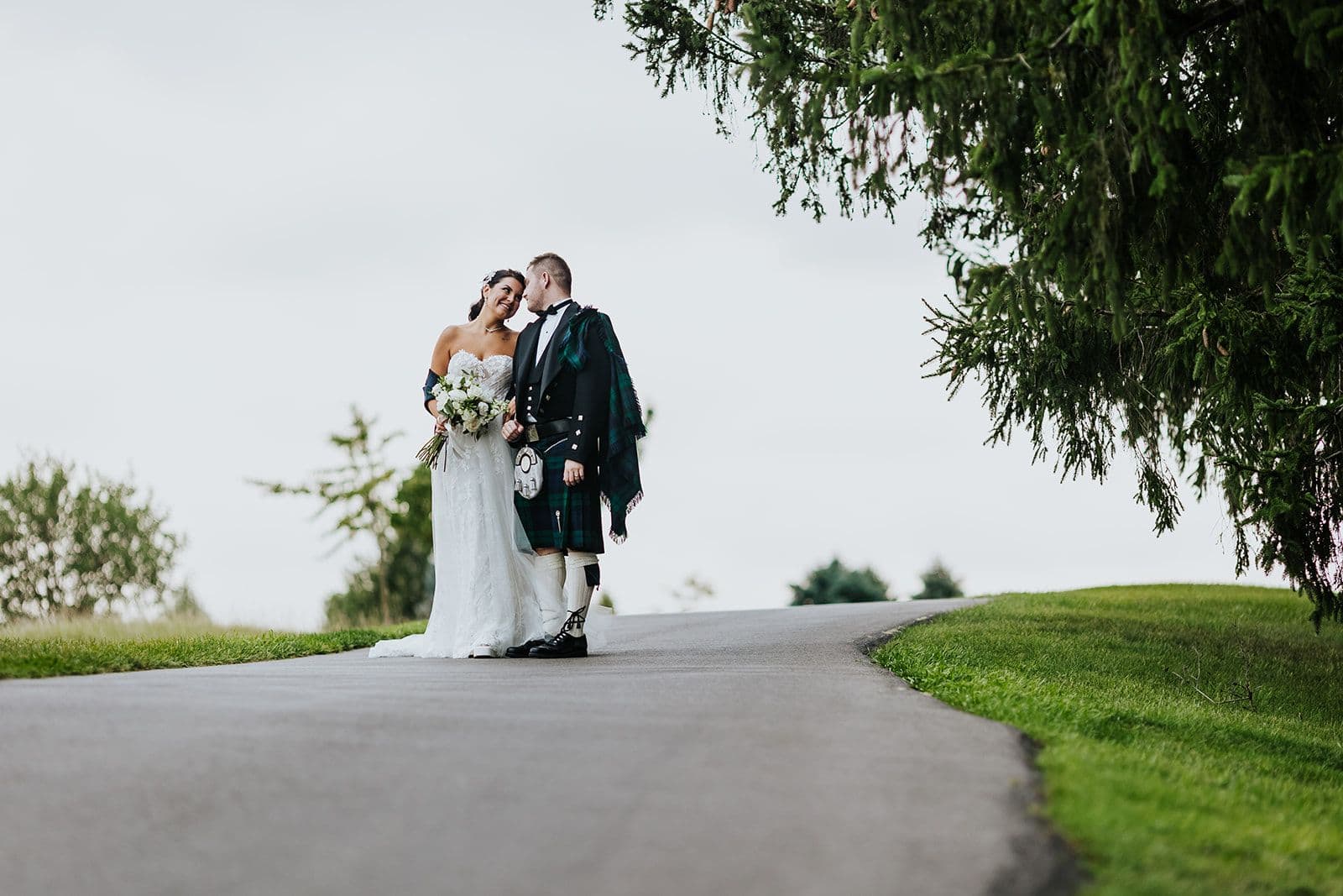 The Wedding Ring, Whistle Bear Golf Club, Wedding Venue, Kitchener Waterloo Wedding Venue, Fedora Media, Kitchener Wedding Photographer, Bride & Groom walking hand in hand down a path