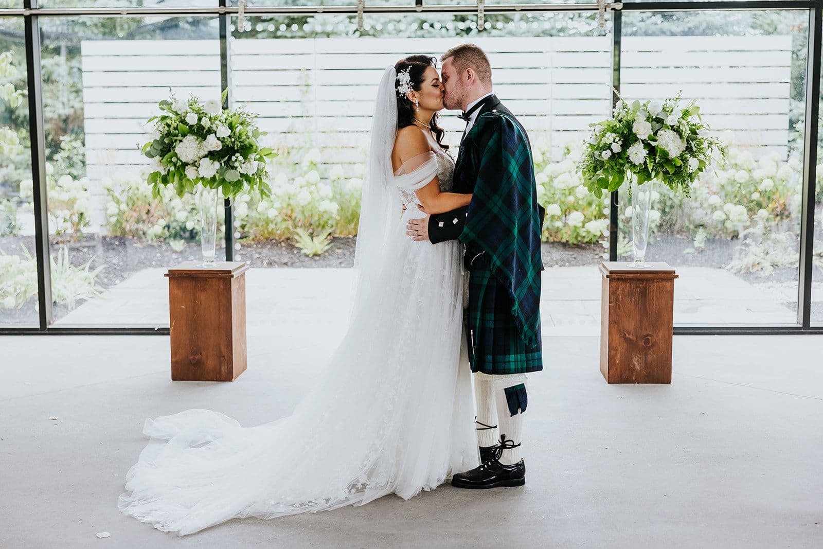 The Wedding Ring, Whistle Bear Golf Club, Wedding Venue, Kitchener Waterloo Wedding Venue, Fedora Media, Kitchener Wedding Photographer, Bride and Groom kissing at top of wedding alter