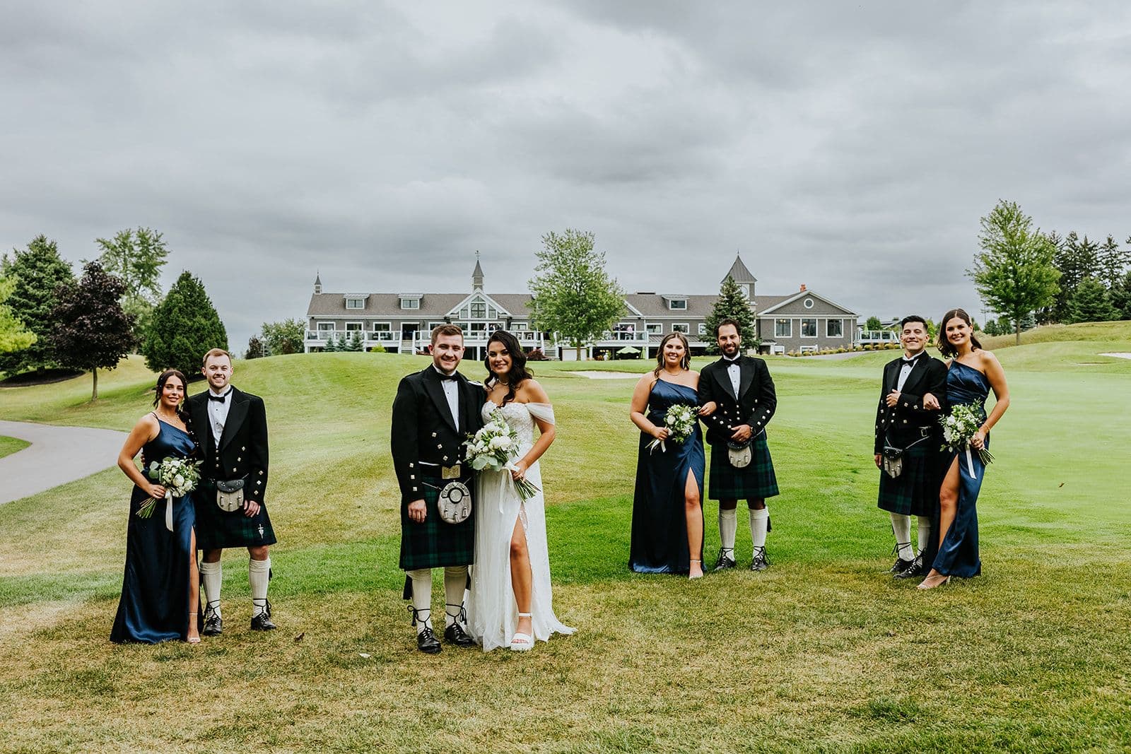 The Wedding Ring, Whistle Bear Golf Club, Wedding Venue, Kitchener Waterloo Wedding Venue, Fedora Media, Kitchener Wedding Photographer, Bride and Groom standing with wedding party on the golf course with Whistle bear in the background
