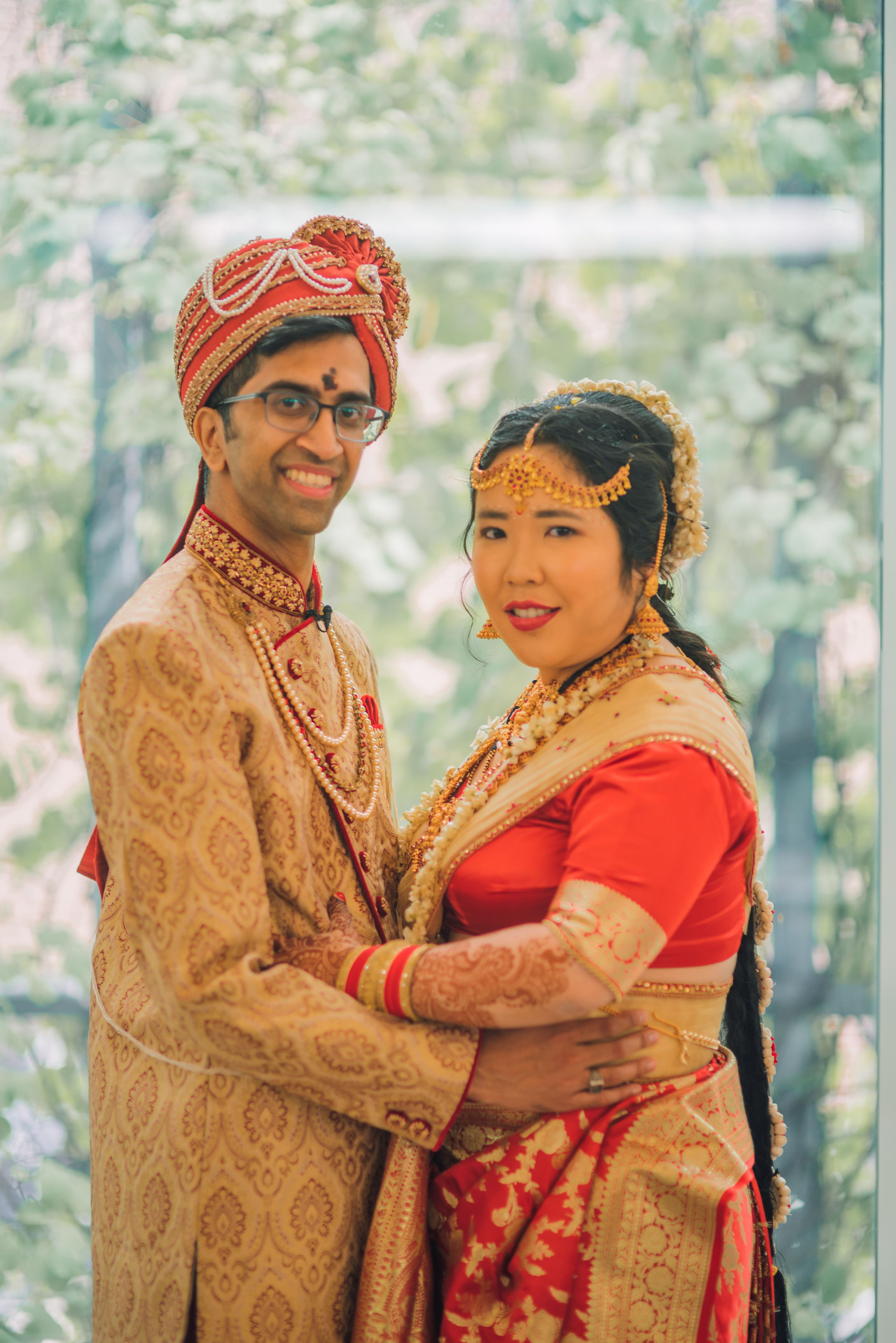 The Wedding Ring, Kitchener Public Library, Peter B Photography, KW wedding photographer, Kitchener wedding venue, Waterloo wedding venue, Cambridge wedding venue, bride and groom in front of pink floral wall