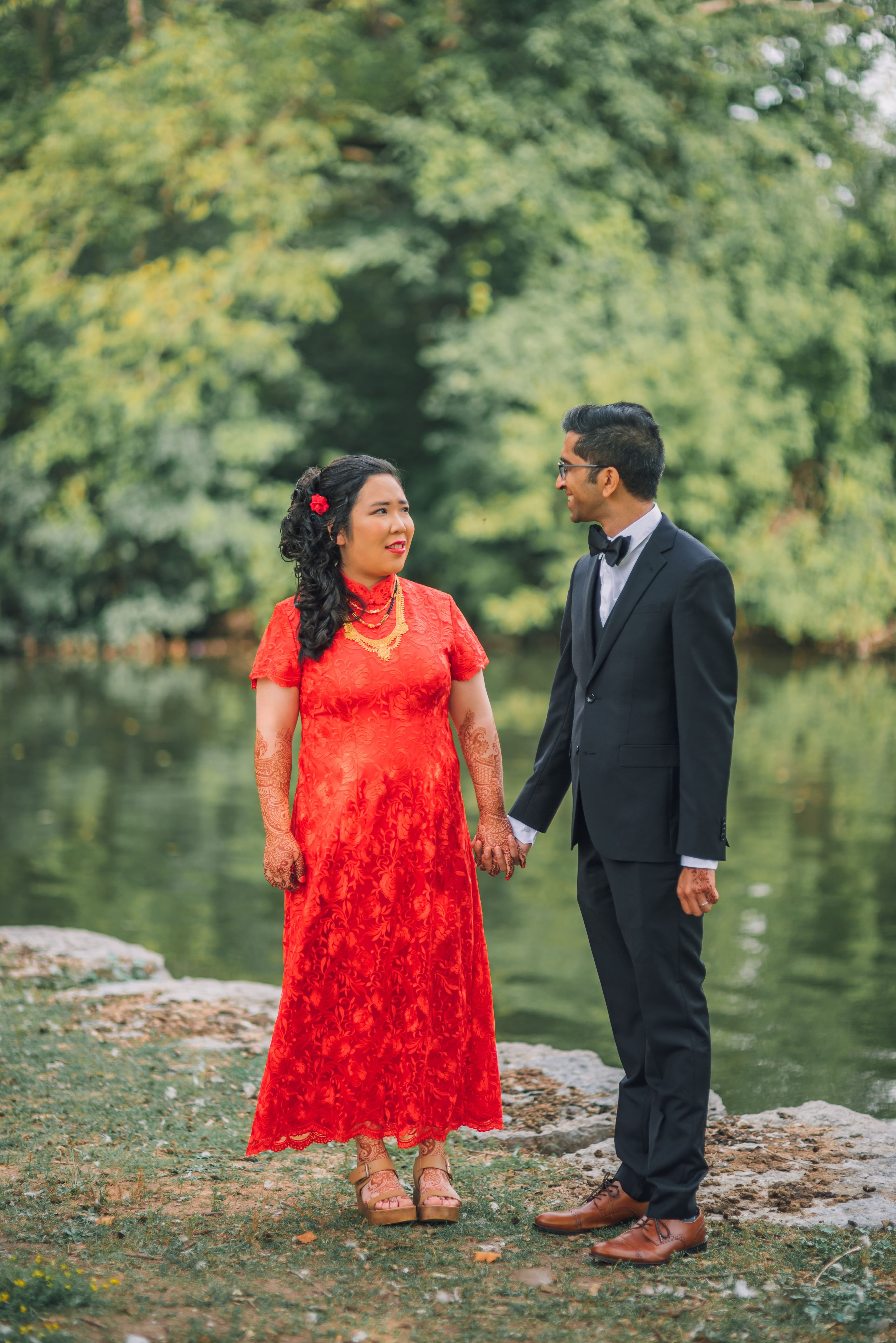 The Wedding Ring, Kitchener Public Library, Peter B Photography, KW wedding photographer, Kitchener wedding venue, Waterloo wedding venue, Cambridge wedding venue, bride and groom looking at each other in a park with a pond behind them
