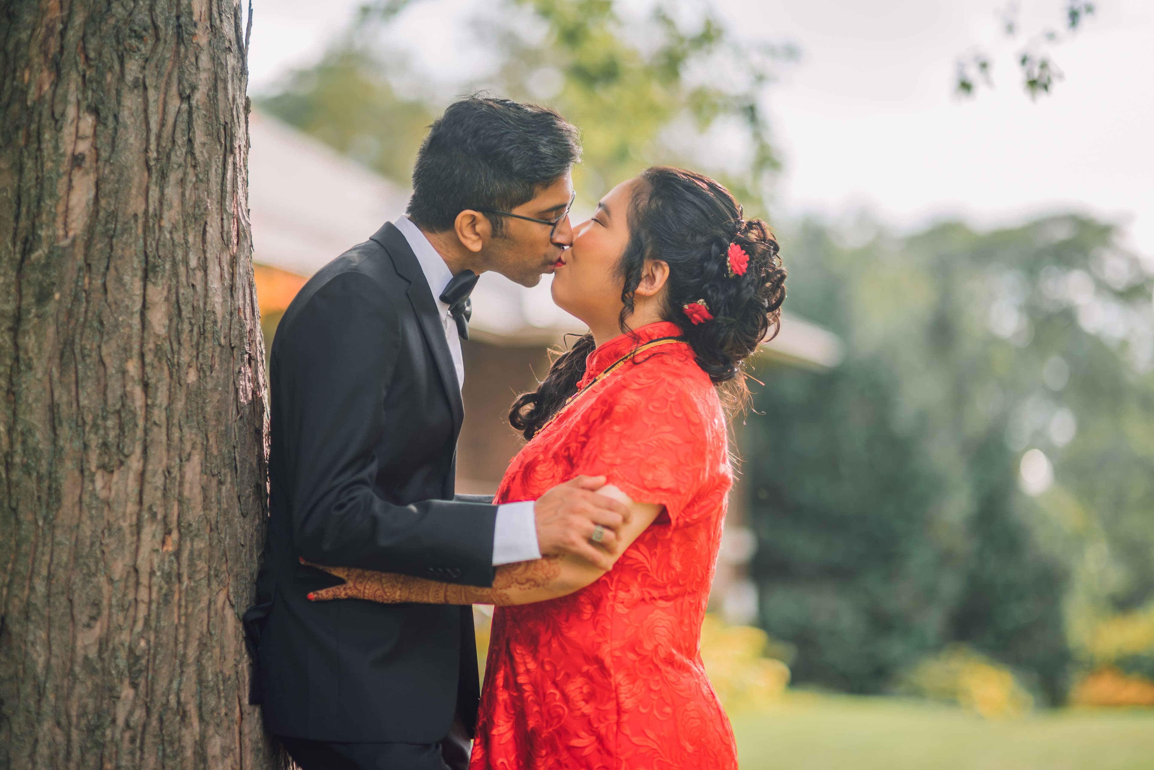 The Wedding Ring, Kitchener Public Library, Peter B Photography, KW wedding photographer, Kitchener wedding venue, Waterloo wedding venue, Cambridge wedding venue, bride and groom kissing up against a tree in the park