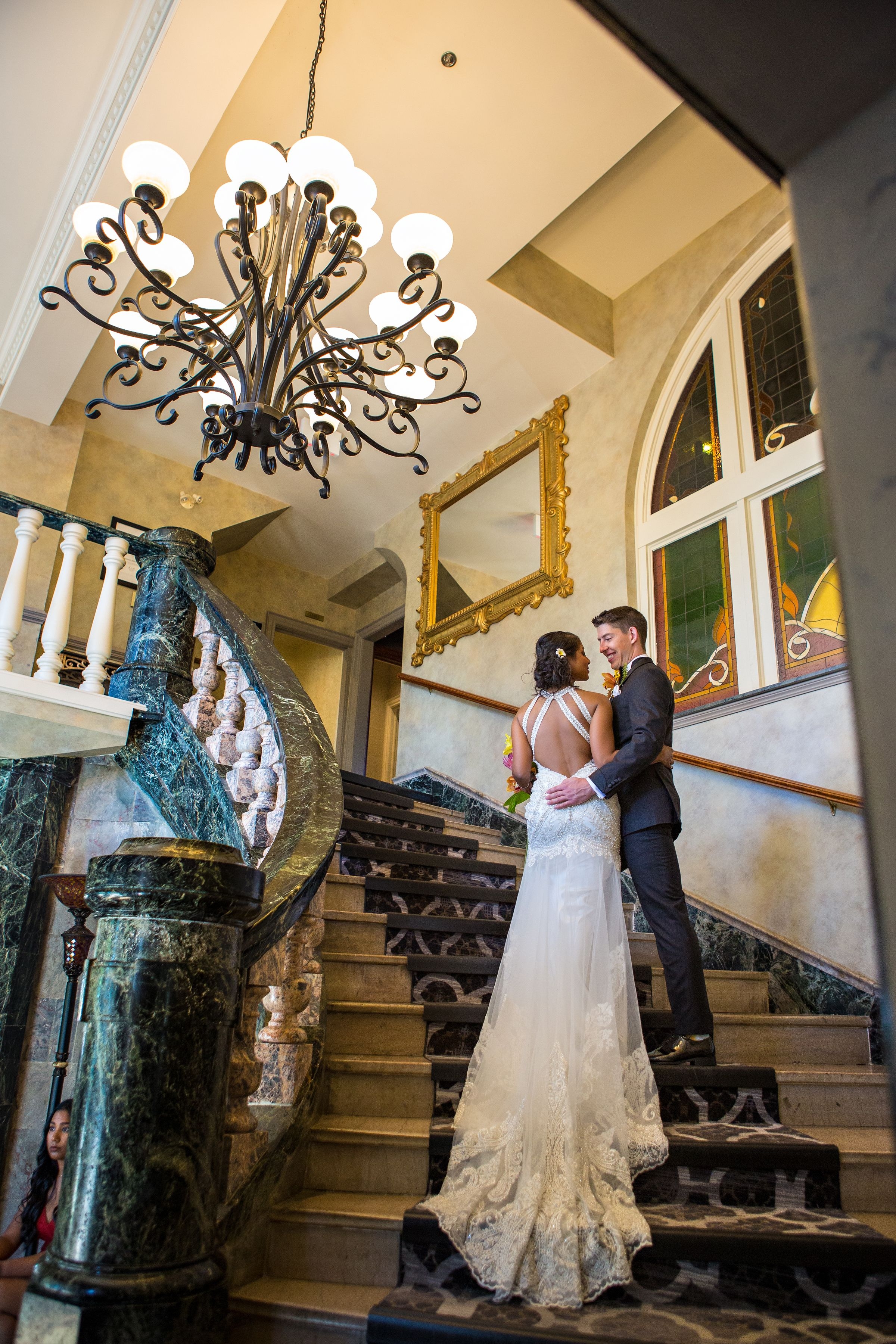 the wedding ring, DA Photography, KW wedding photographer, Edgewater manor, stoney creek wedding venue, bride and groom walking up a gorgeous flight of stairs