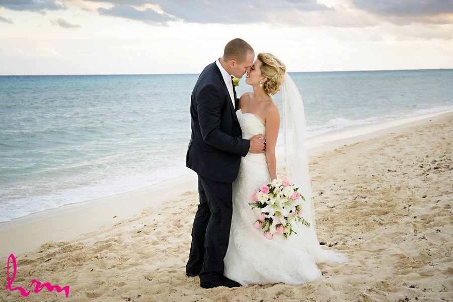 bride and groom embracing on a beach, photo by HRM Photography, Legally Married in Ontario